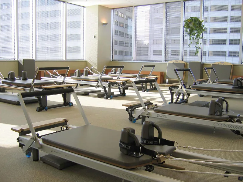 Pilates reformer machines in a bright studio