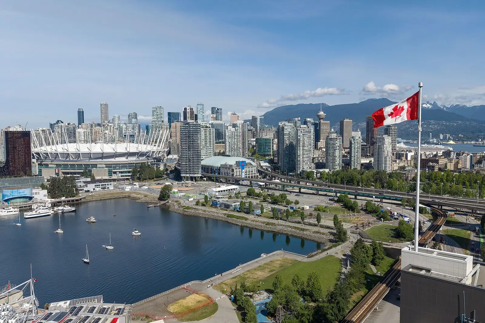 Downtown Vancouver towers and BC Place beside False Creek